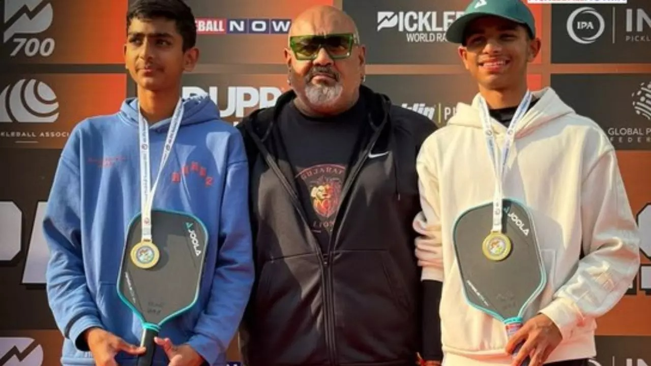 (LR): Dev Shah and Purvansh Patel with IPA President Suryaversingh Bhullar (Center) Pose after winning the U-18 Boys Doubles Title at the 4th IPA NATITTTTTTTTTTTTTTTET UNIVERSITY, GRIDA.