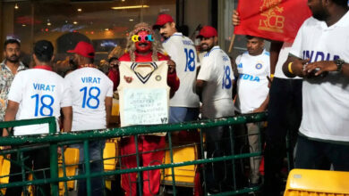 RCB Fans Turn Up in Whites to pay tribute to Virat Kohli Despite Heavy Rain