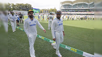 India's captain Rohit Sharma, Right, and Teammate Virat Kohli Leave the Field Af ...