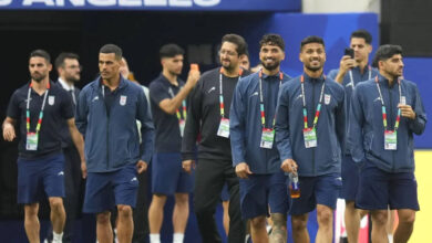 iran arrive in us under tight security as anti-regime protesters gather before world cup opener